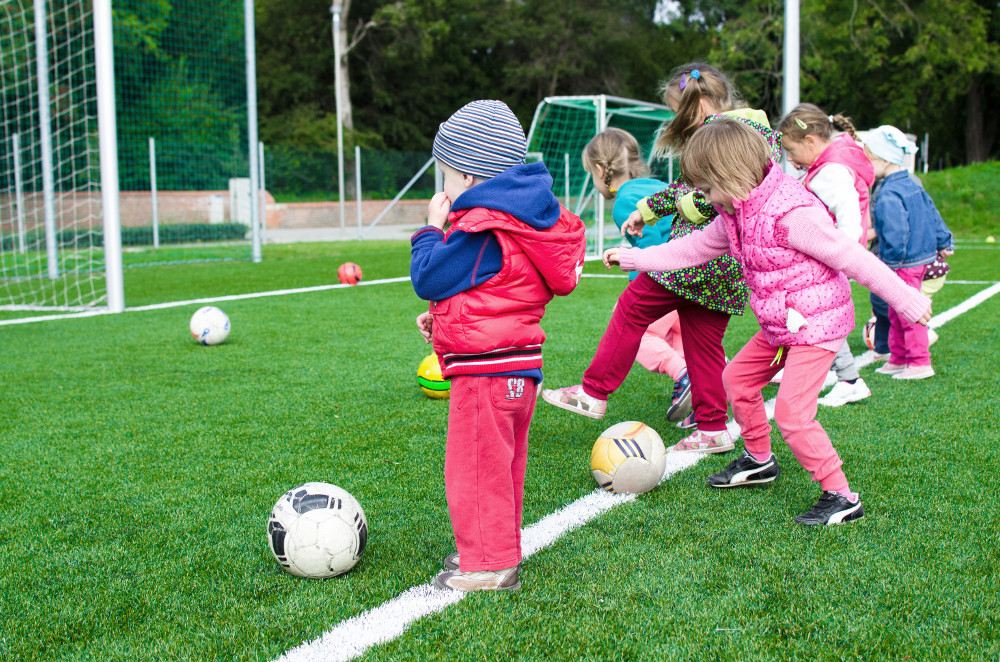 Children train football skills